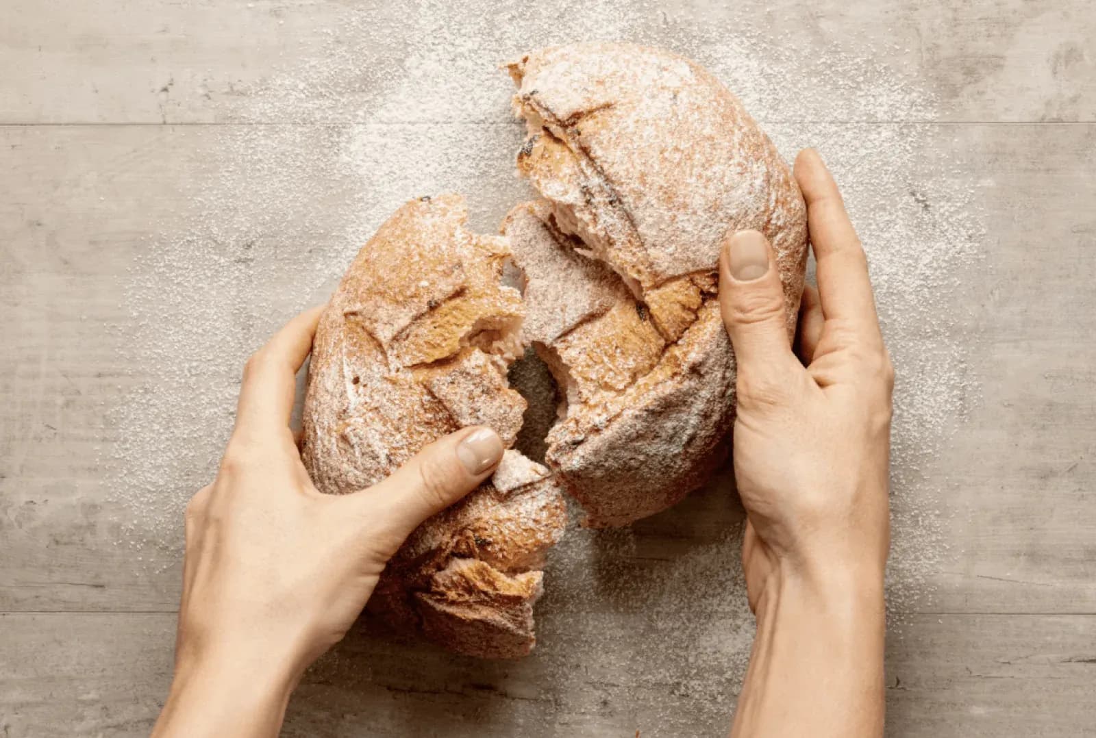 bread being handled on a table