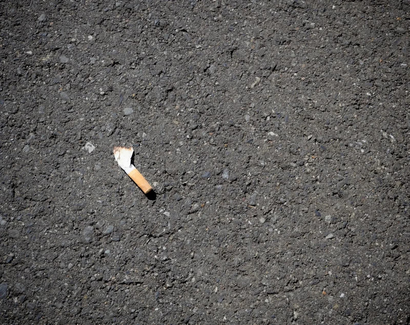 a cigarette on the ground